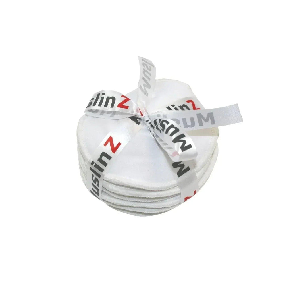 Stacked muslin pouches tied with a ribbon