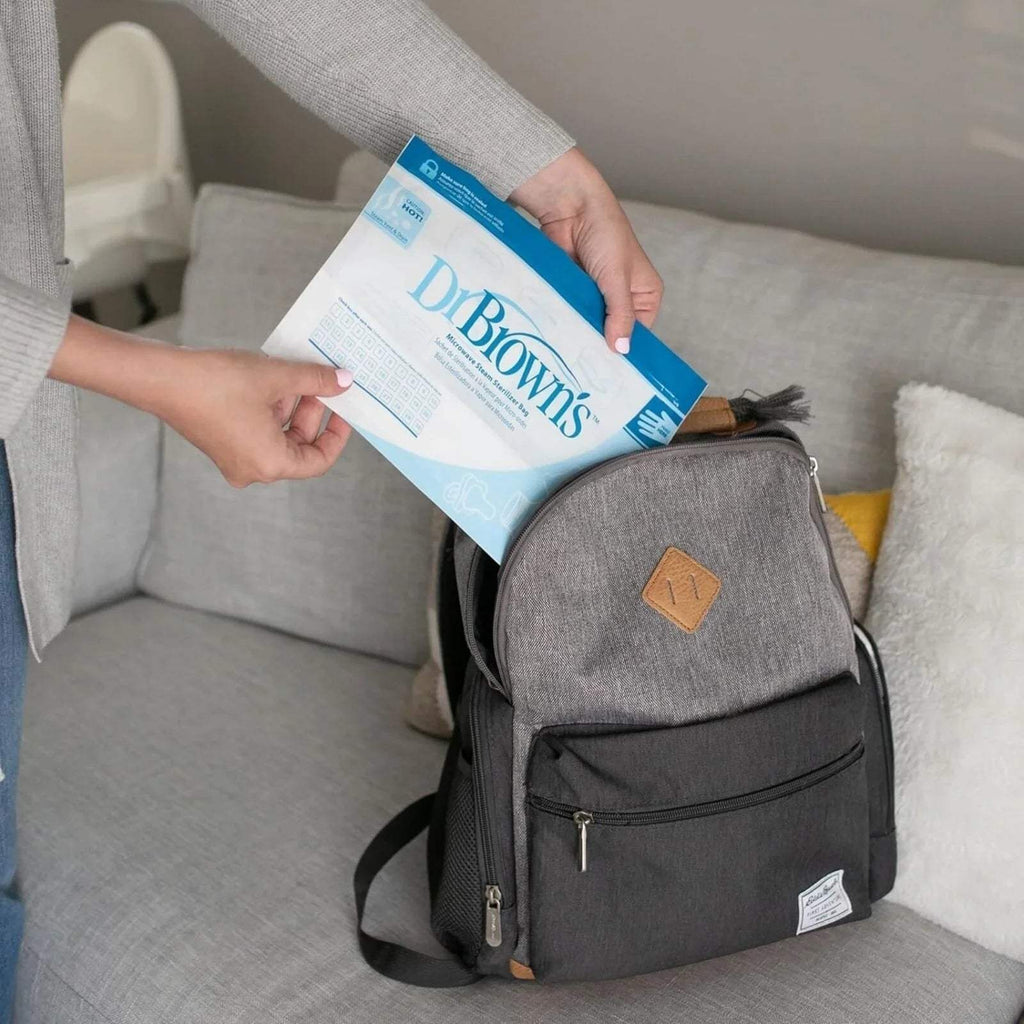 Gray baby storage bag holding Dr. Brown's microwave steam steriliser bag pack