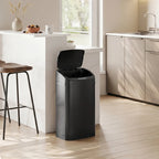Black 48 L sensor bin near kitchen counter with closed lid and quiet, clean design.