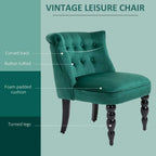 Dark green wingback accent chair with button-tufted back and foam-padded seat callouts
