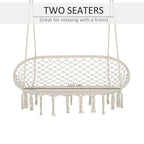 Cream hanging macrame hammock chair with oval net seat and long fringe tassels