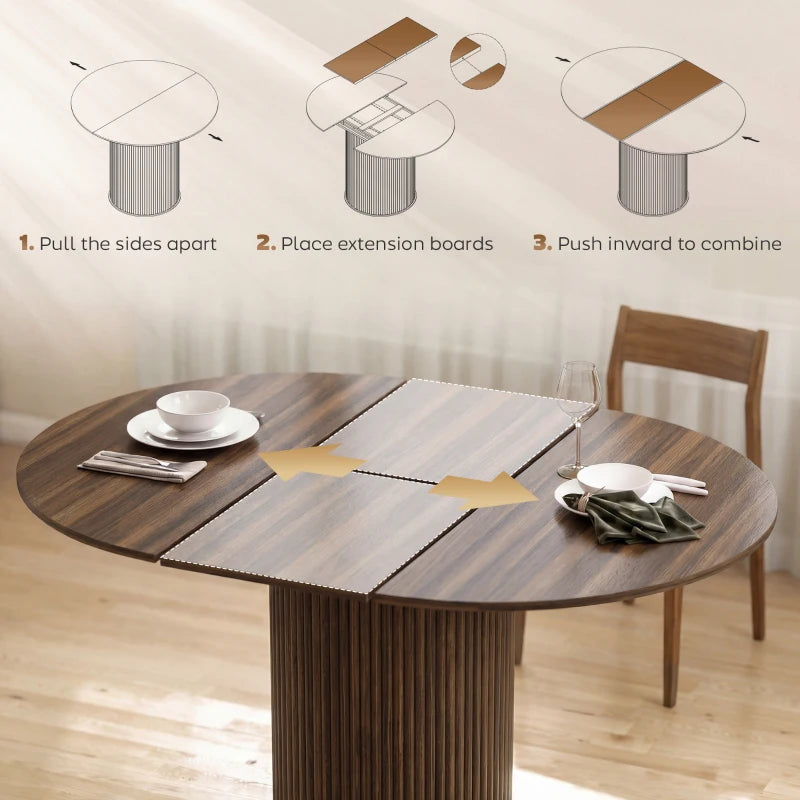 Extendable round dining table in dark walnut with extension leaves pulled out
