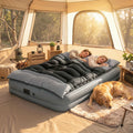 Double sleeping bag with two pillows, black and grey quilted bed, tent-ready.