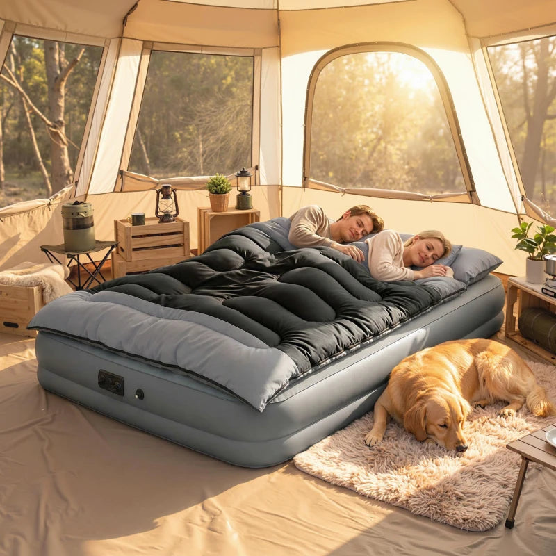 Double sleeping bag with two pillows, black and grey quilted bed, tent-ready.