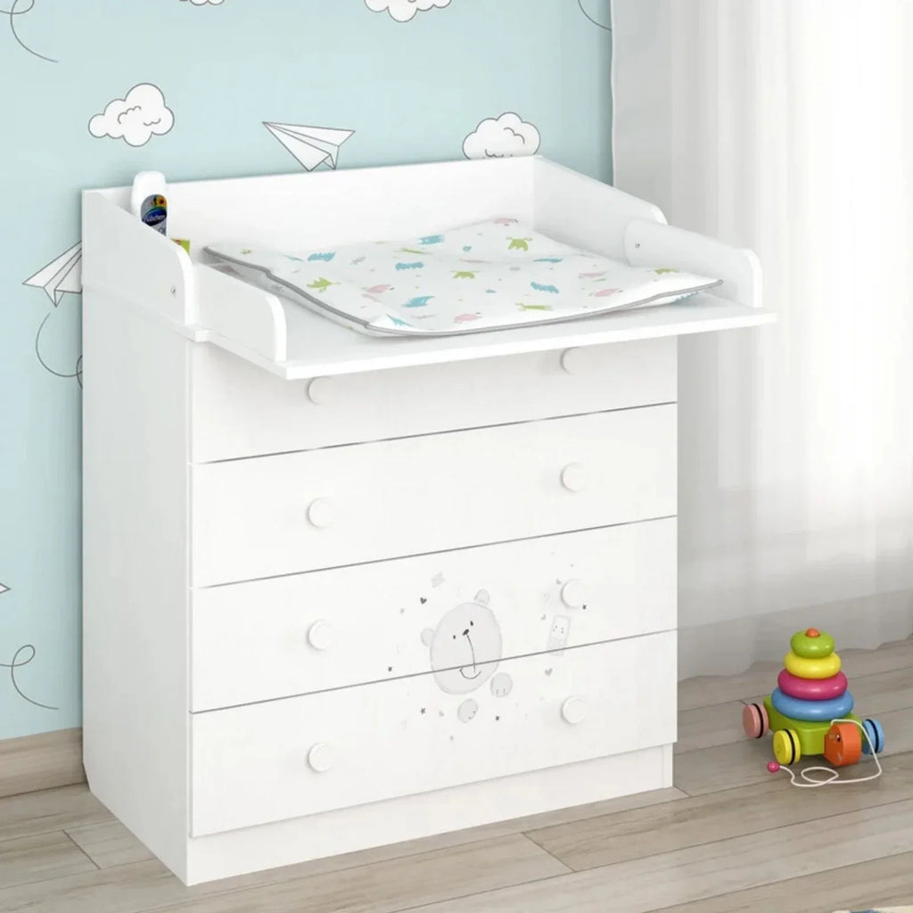 White kids changing dresser with rounded knobs, teddy panel, and wide changing pad surface