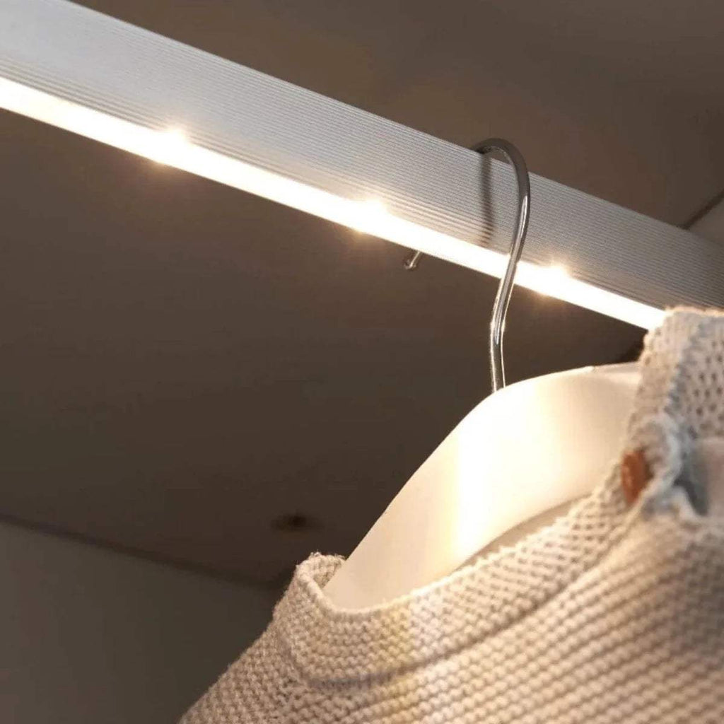 Wardrobe interior light strip under the top panel