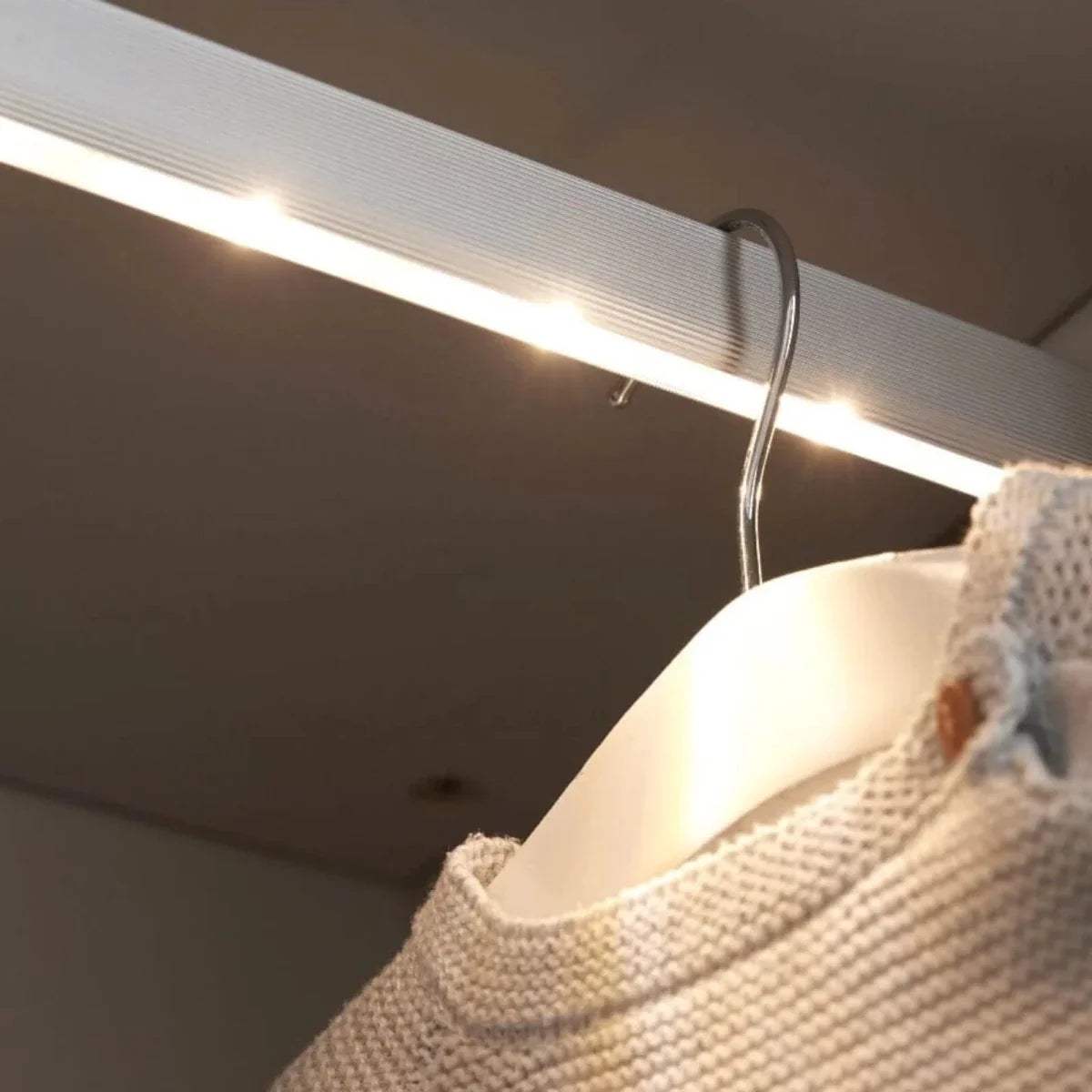 Wardrobe interior light strip under the top panel