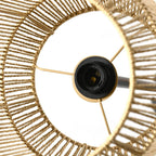 Close-up of woven rattan lampshade with bulb socket and cross wires