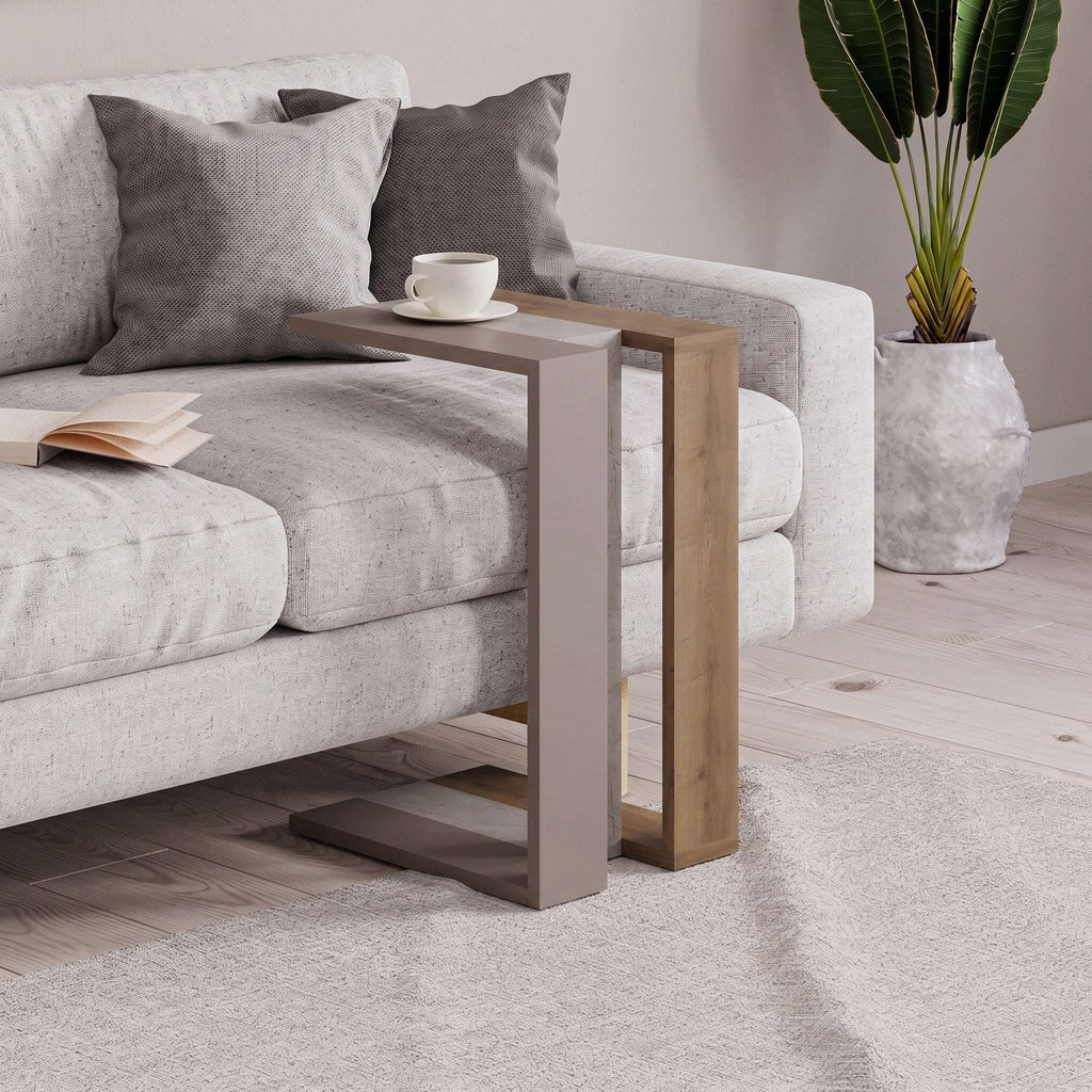 C-shaped side table in light wood with dark gray center panel and shelf
