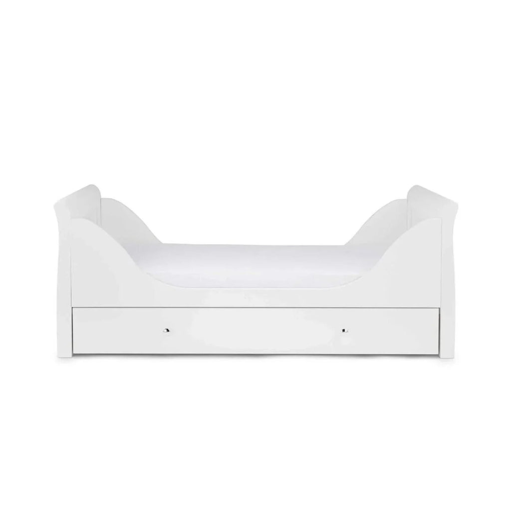 White cot bed with end panels and padded mattress base
