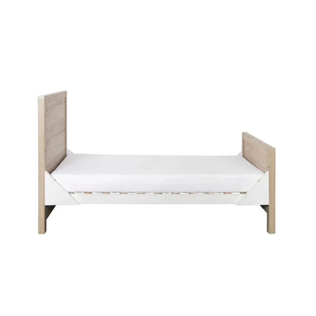 Low junior sofa bed with light oak end panels and white mattress, no side rails