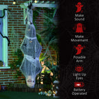 Hanging grey mummy decoration with glowing eyes, spider web wrap, posable arms