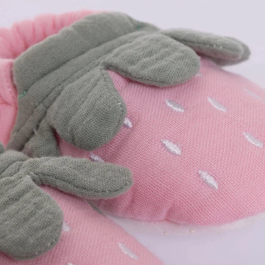 Pink baby booties with gray knit leaf detail and white dot pattern