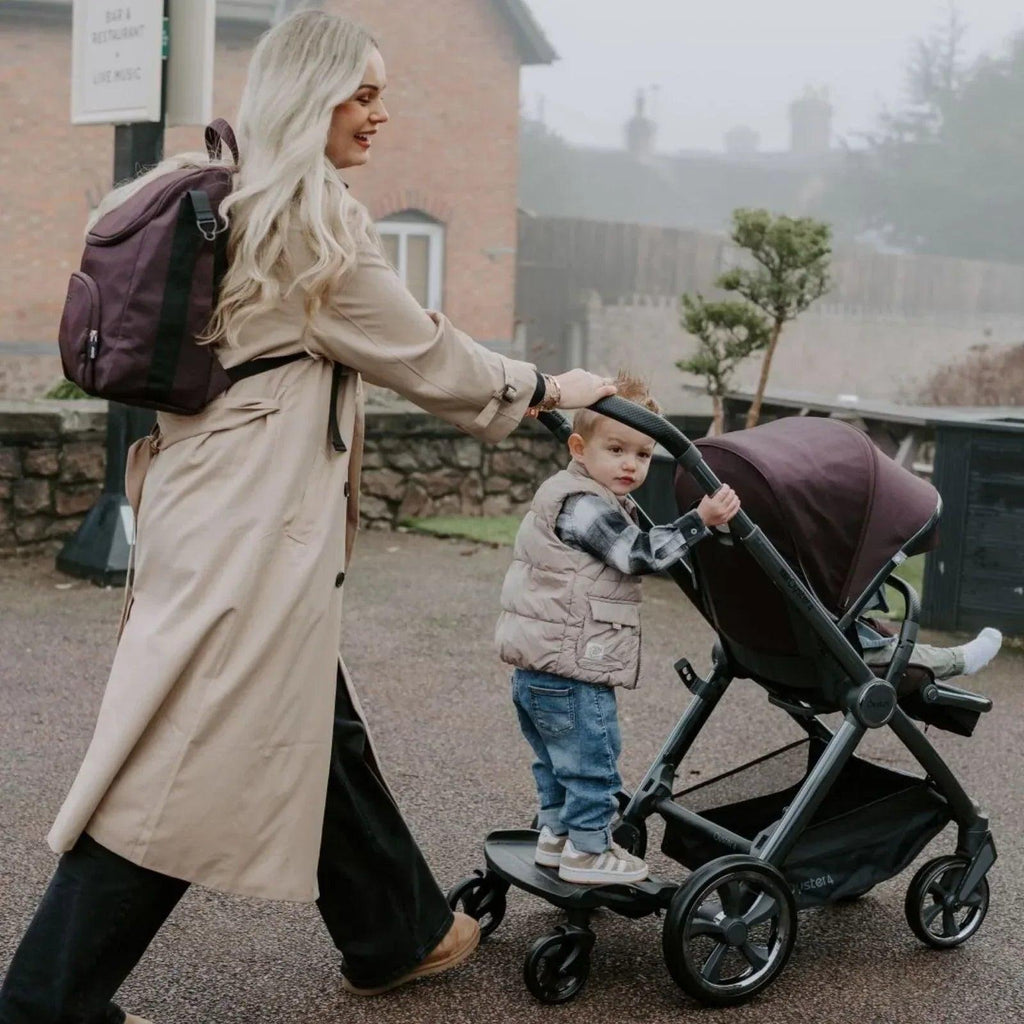 Chocolate-brown stroller with canopy and padded seat, front wheels shown