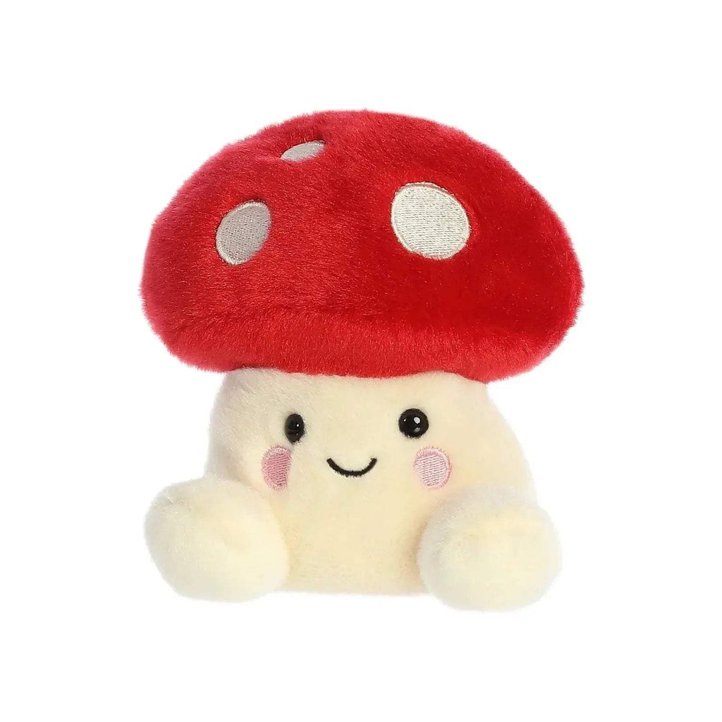 Cute mushroom soft toy with red cap, white spots, and cream arms with round hands