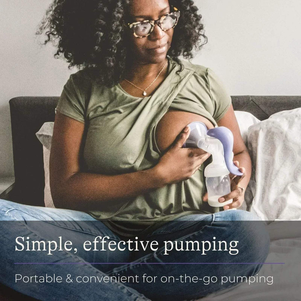 Woman using Lansinoh manual breast pump with clear bottle and purple handle