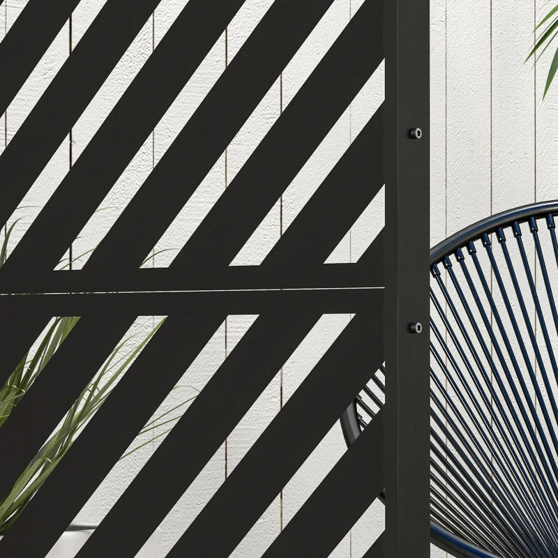Black metal privacy screen corner with diagonal stripe triangle pattern, close-up