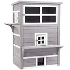Grey three-tier wooden cat house with front door, window, and jump platforms