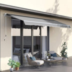 Retractable porch awning extended over patio, light grey fabric with scalloped edge