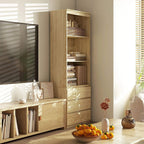 Tall oak-effect bookcase with open shelves and drawers, styled in a living space