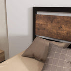Single metal bed frame corner view with headboard, rustic brown panel back and black side rails