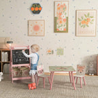 Pink kids table and two chairs with animal backs and chalkboard easel
