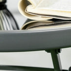 Close-up of folding chair frame arm and light grey fabric panel edge