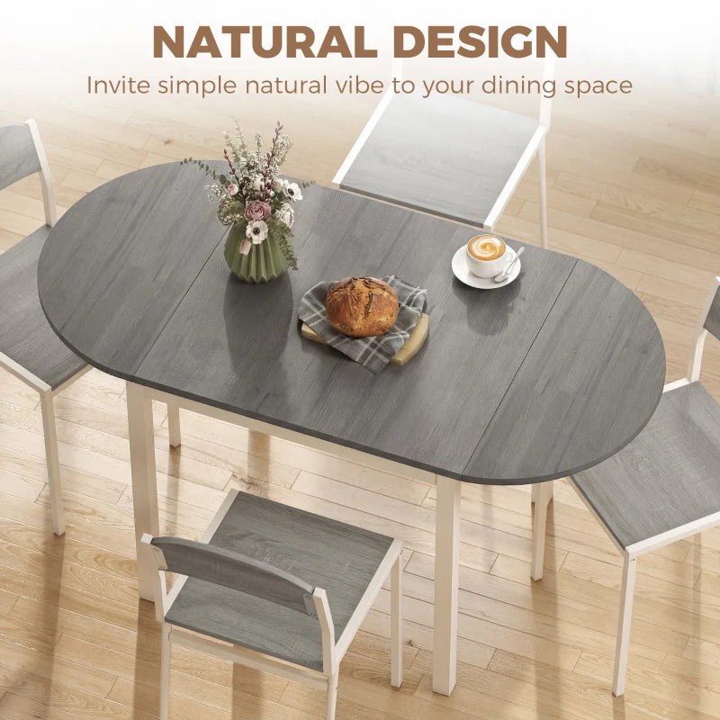 Grey drop-leaf dining table with white legs, fully opened oval tabletop