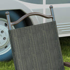 Close-up of folding garden chair backrest with dark mesh fabric and dark brown frame