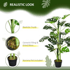 Artificial monstera tree with green leaves in a black nursery pot