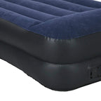 King-size air bed valve on dark gray side for inflation and deflation.