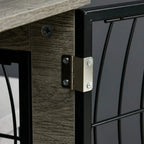 Close-up of black wire door hinge and latch on grey dog crate end table