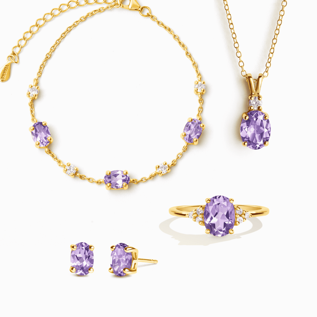 Gold vermeil jewelry set with purple gemstone necklace, ring, and stud earrings.