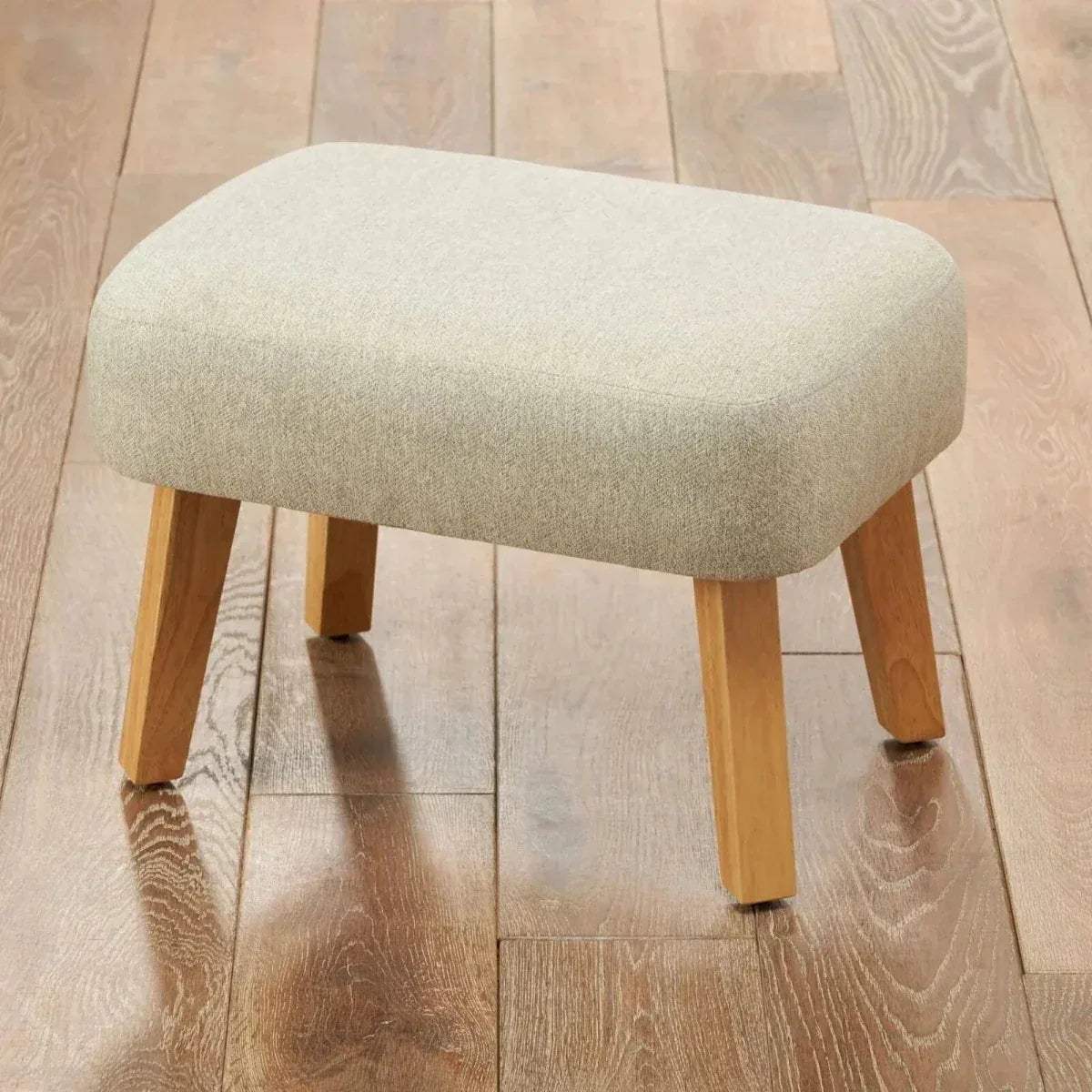 Beige upholstered foot stool with solid wood legs