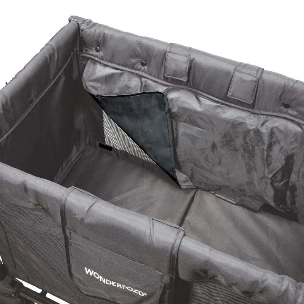 Jet black stroller wagon interior with seatback organizer pockets and padded sidewalls