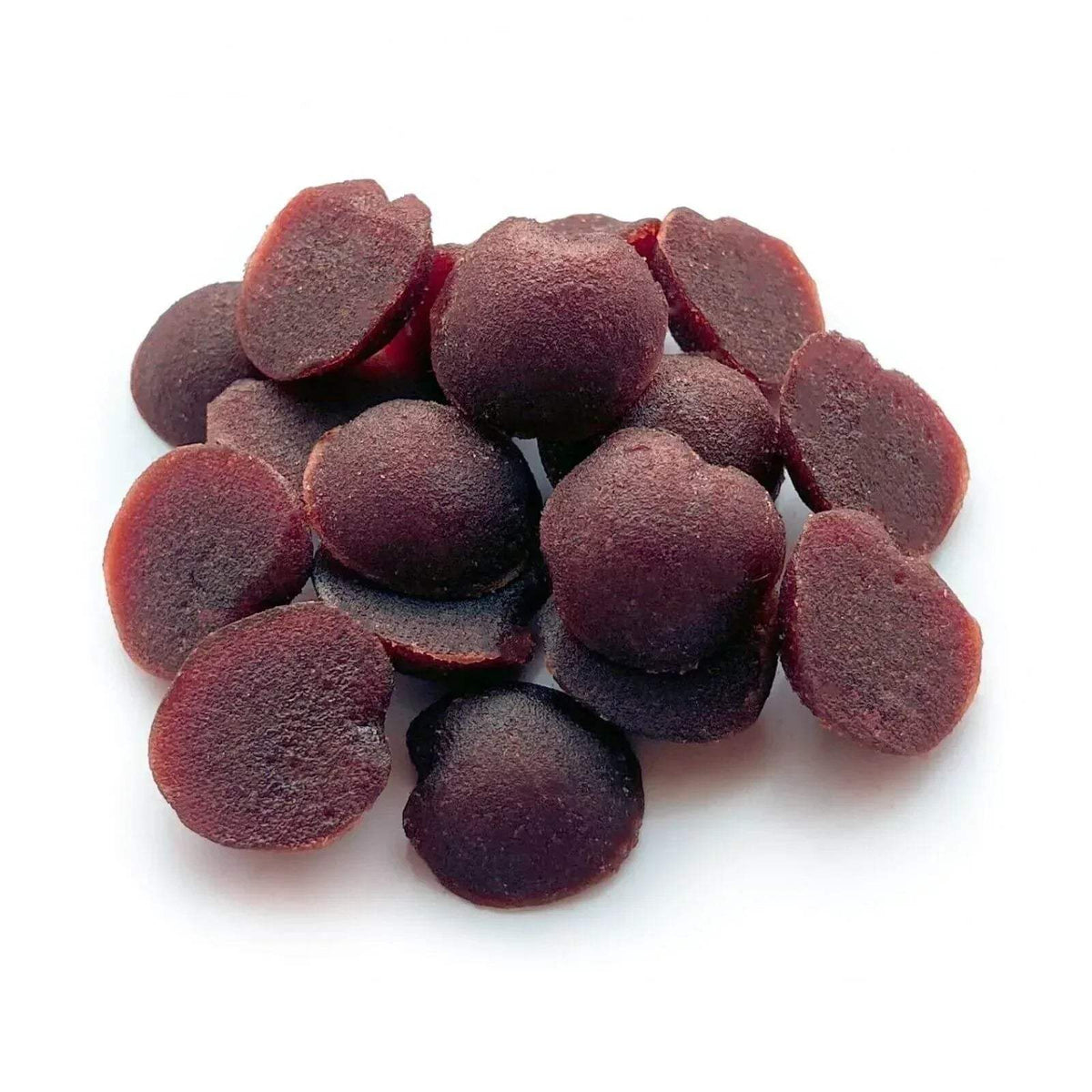 Raspberry and apple fruit drops, dark red chewy candies, scattered