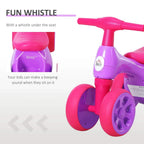 Purple toddler balance bike with pink T-bar handle and padded seat