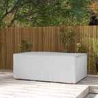 Grey rectangular waterproof patio furniture cover on outdoor deck, sofa set style