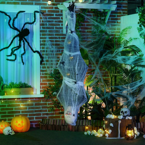 Hanging grey mummy decoration with glowing eyes and spider web-covered body