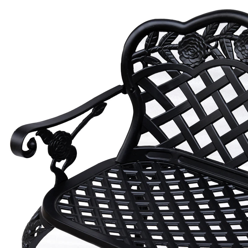 Black cast aluminum garden bench close-up of seat slats and arm scroll detail