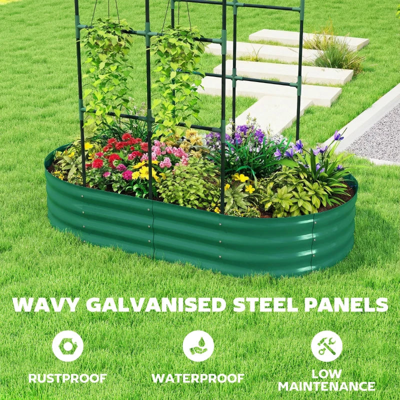 Green galvanized raised garden bed with arched trellis, filled with flowers and leafy plants