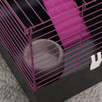 Corner view of small animal cage with purple bars and black base tray