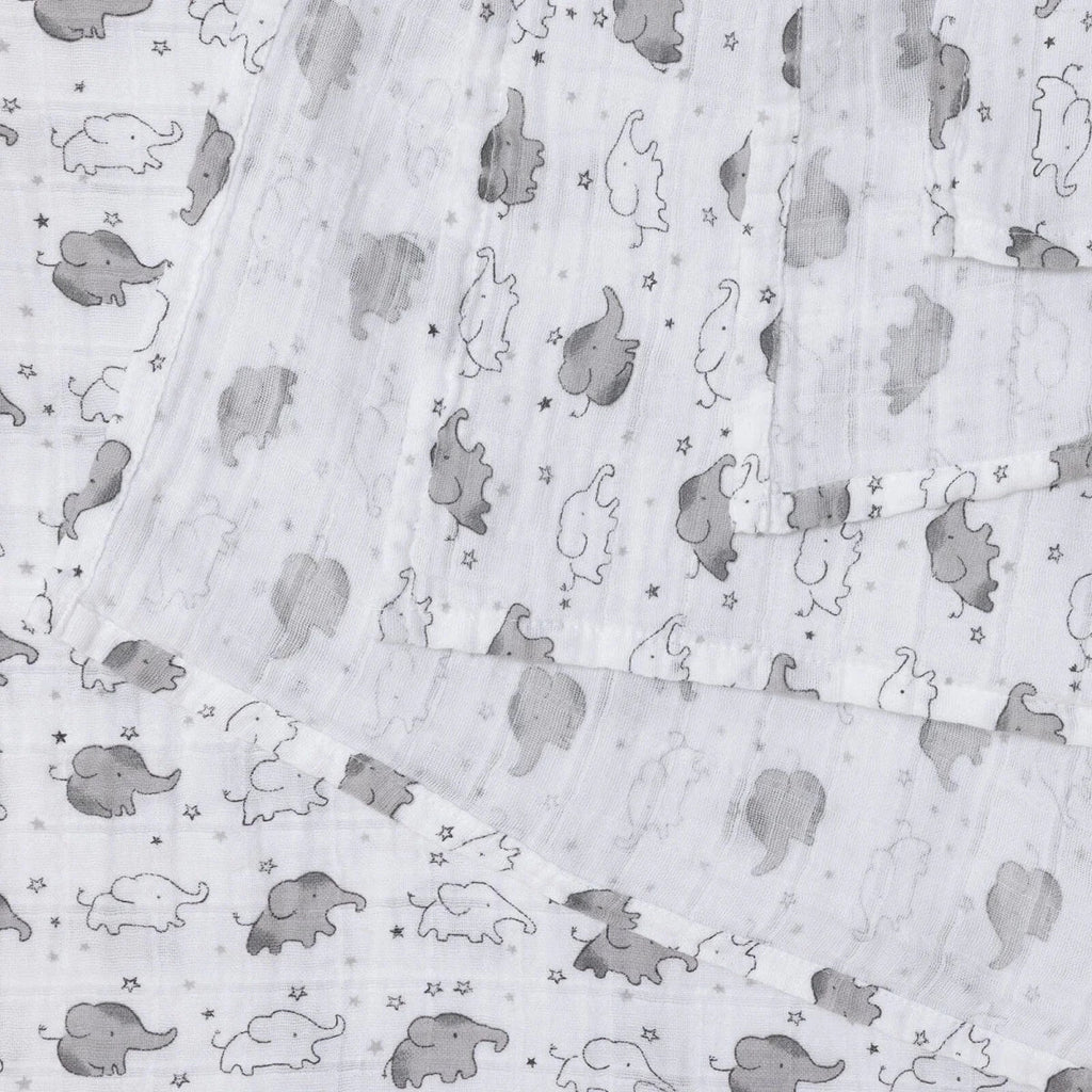 White cotton muslin blanket showing gray elephant pattern and scattered star motifs