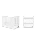 White mini crib and matching drawer dresser with slatted rails