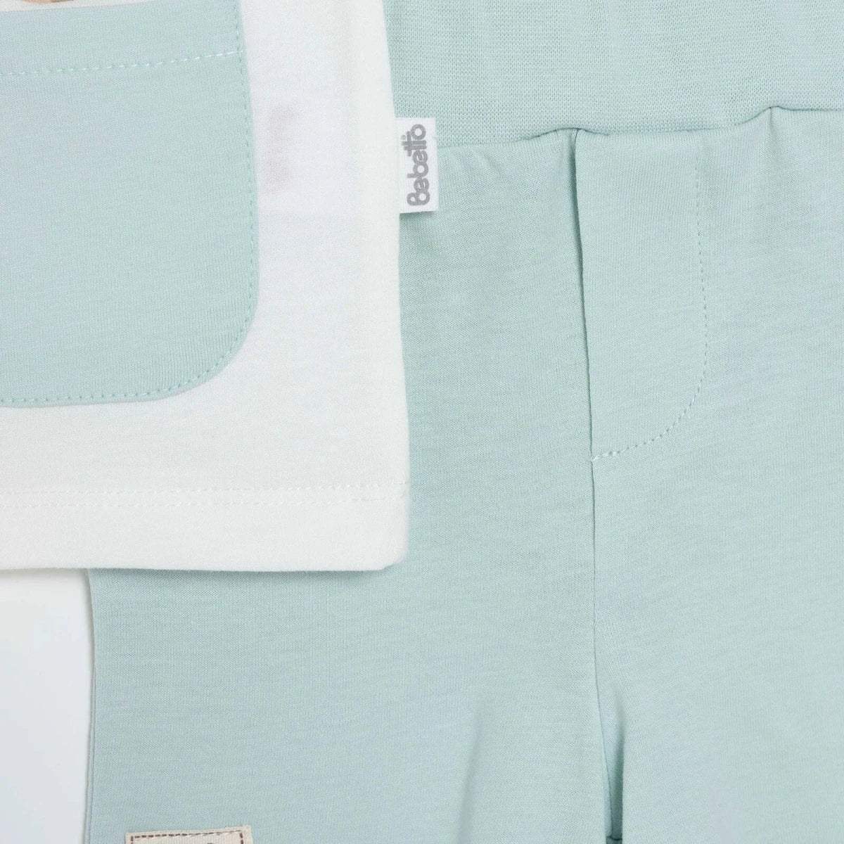Boys light mint shorts with stitched seams and branded fabric tag
