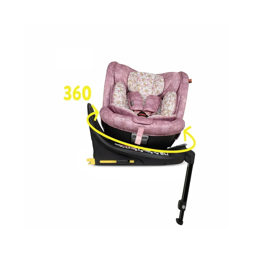 Pink patterned 360° rotating car seat on black base with yellow rotation arrows