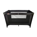 Black travel cot with mesh side panel, padded base, and four foldable legs