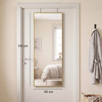 Rectangular full-length mirror with gold-tone frame, mounted on doorway.