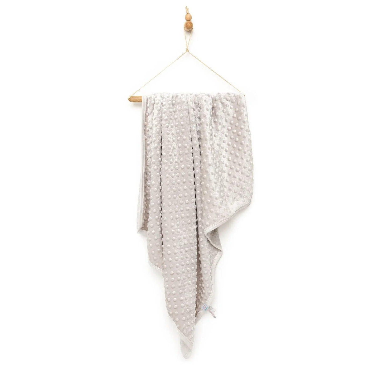 Beige wellsoft fleece baby blanket with allover dot pattern, one size