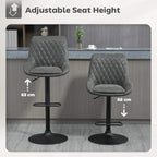 Adjustable-height dark grey bar stool with quilted back, swivel seat, and round base